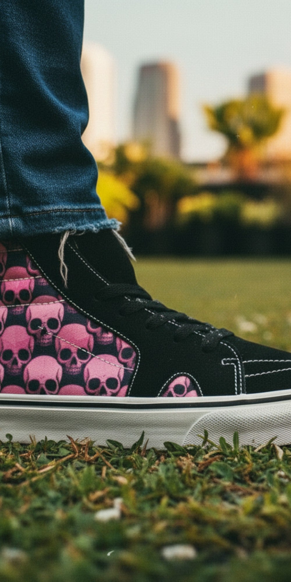 Freaky Shoes® women's high top skate sneakers featuring a black and pink underground skull comix print on grass.