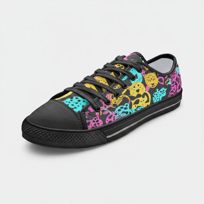 Freaky Shoes® canvas sneakers featuring a vibrant, multi-colored animal print pattern on a black background.