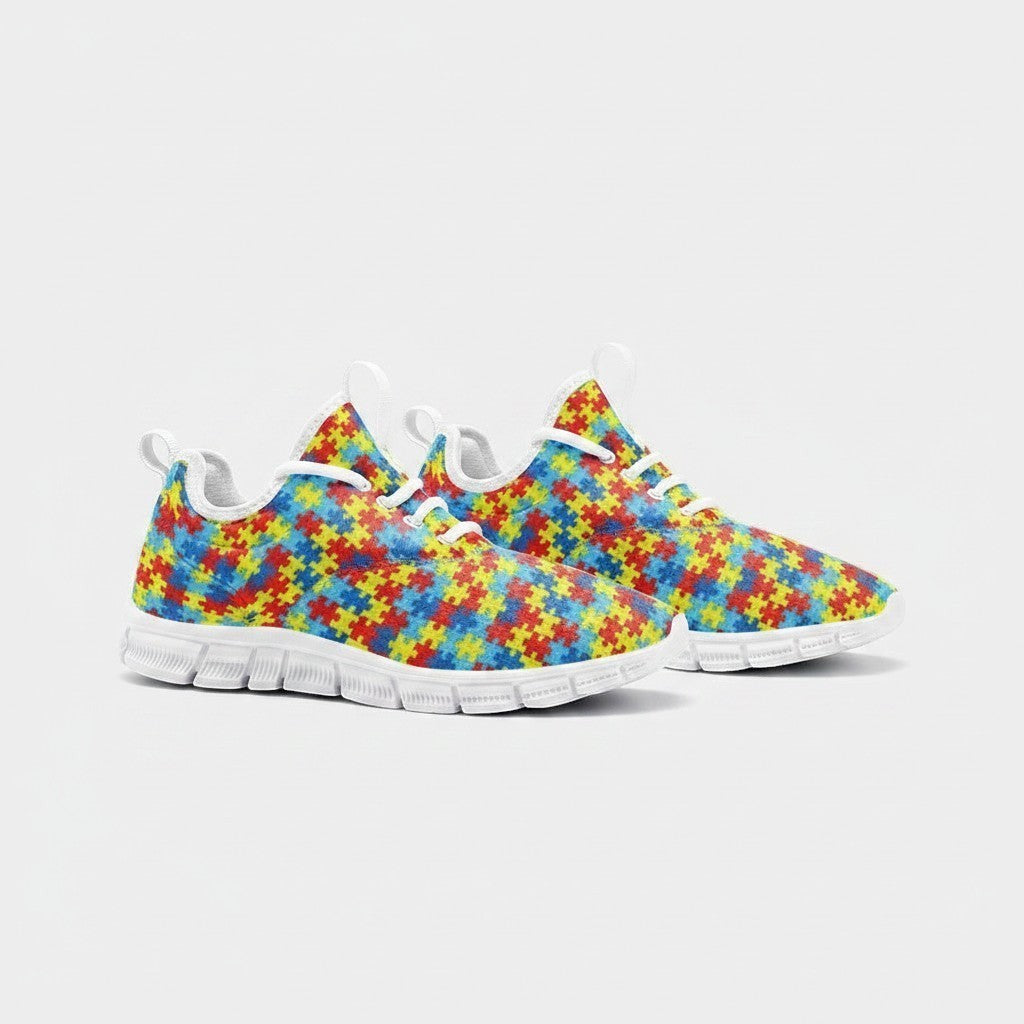 Freaky Shoes® high-top canvas sneakers featuring a colorful autism awareness puzzle piece print and white EVA soles.
