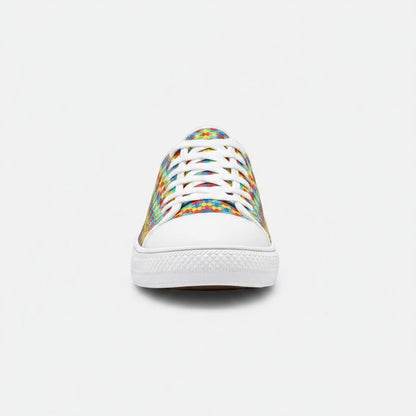 Freaky Shoes® low-top canvas sneakers featuring a colorful autism awareness puzzle piece print and white rubber toe.