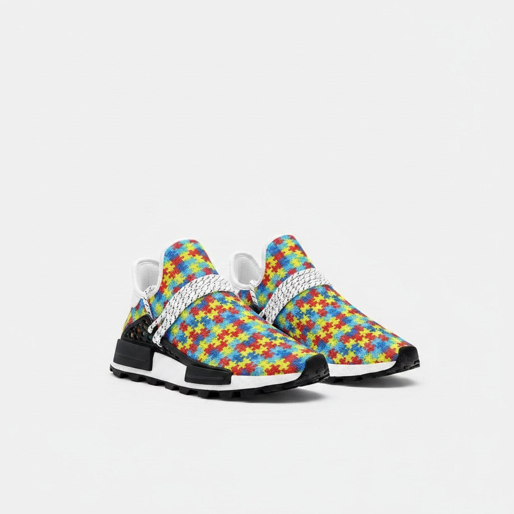 Freaky Shoes® high-top canvas sneakers featuring a colorful autism awareness puzzle piece print and white laces.