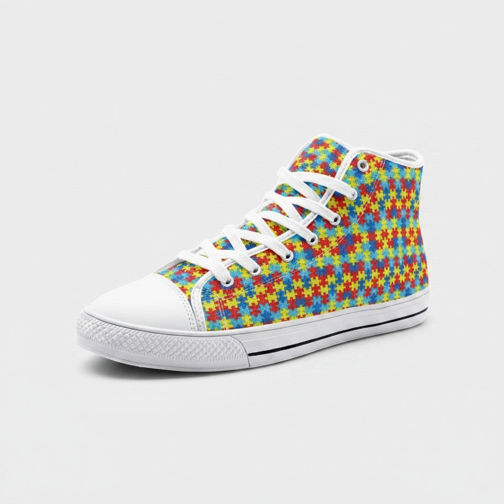 Freaky Shoes® high-top canvas sneakers featuring a colorful autism awareness puzzle piece print and white laces.