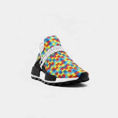 Freaky Shoes® high-top canvas sneakers featuring a colorful autism puzzle piece pattern with white laces and black sole