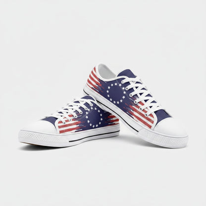 Freaky Shoes® Betsy Ross flag low-top canvas sneakers with red, white, and blue distressed print and white laces.