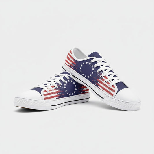 Freaky Shoes® Betsy Ross flag low-top canvas sneakers with red, white, and blue distressed print and white laces.
