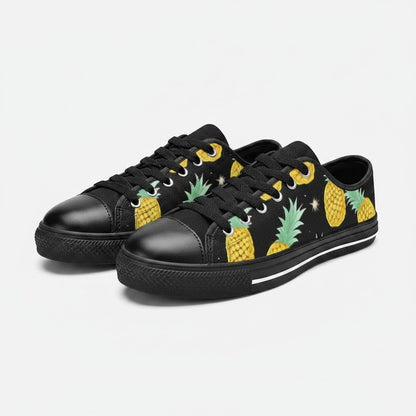 Freaky Shoes® women's black canvas low-top sneakers featuring a yellow pineapple and star pattern.