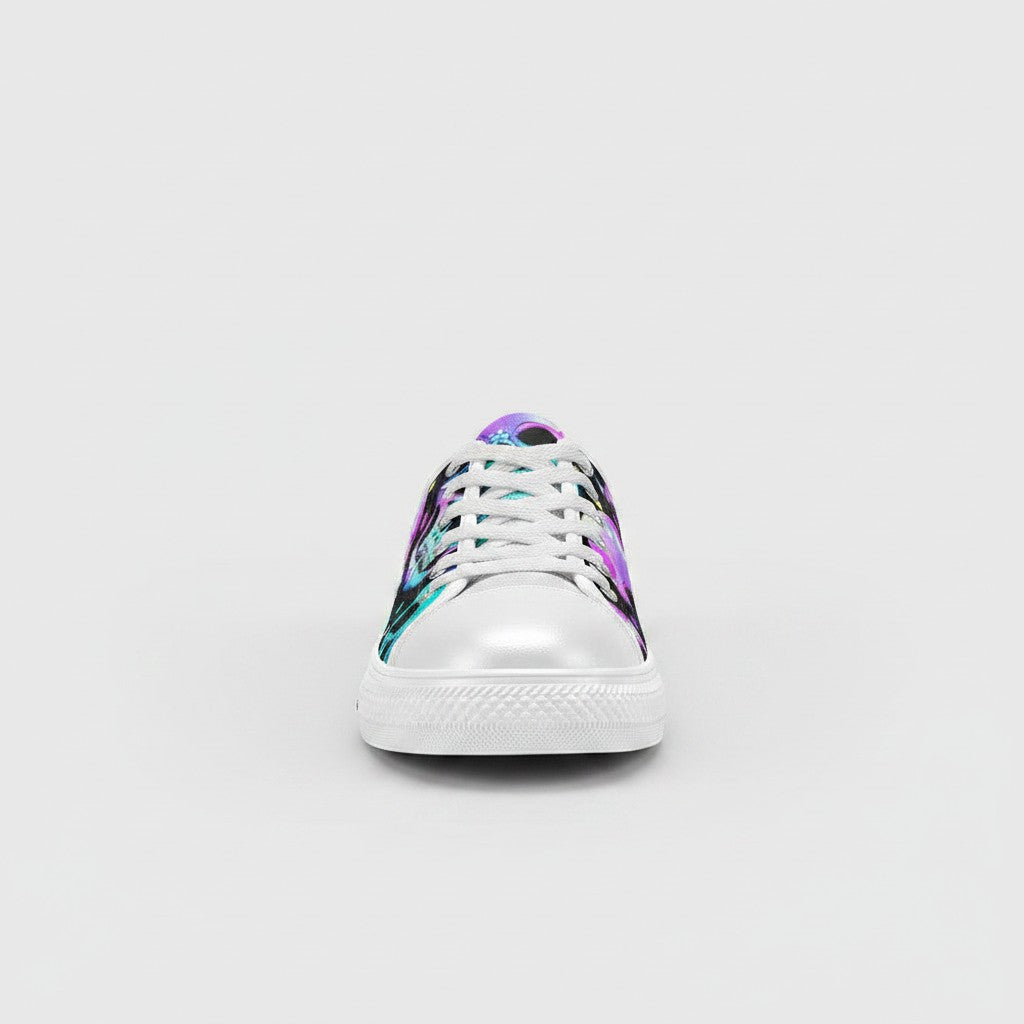 Freaky Shoes® women's canvas sneakers featuring a vibrant, multi-colored skull print with white laces and toe cap.