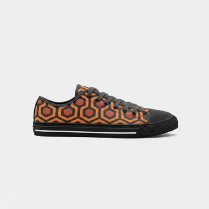 Freaky Shoes® low-top canvas sneakers featuring an orange and black geometric carpet pattern and lace-up closure.