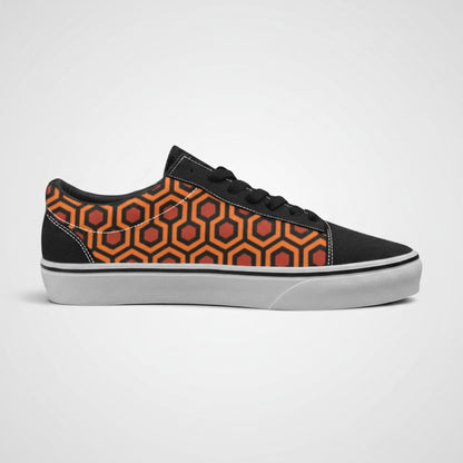 Freaky Shoes® low-top canvas sneakers featuring a vibrant orange and black geometric carpet pattern