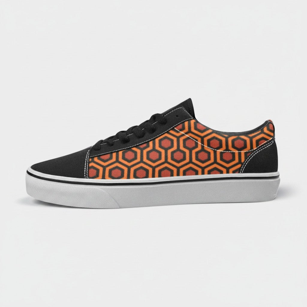 Freaky Shoes® women's low-top canvas skate shoes featuring an orange and black geometric carpet pattern design.