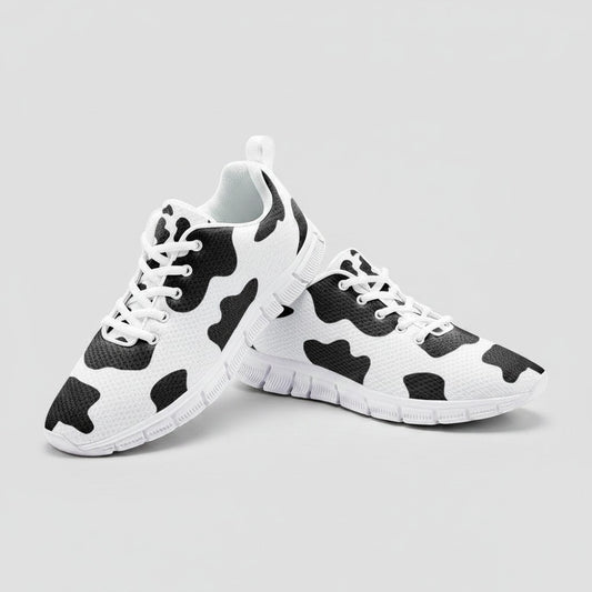 Freaky Shoes® high-top canvas sneakers featuring a black and white cow print pattern with white laces and EVA soles.