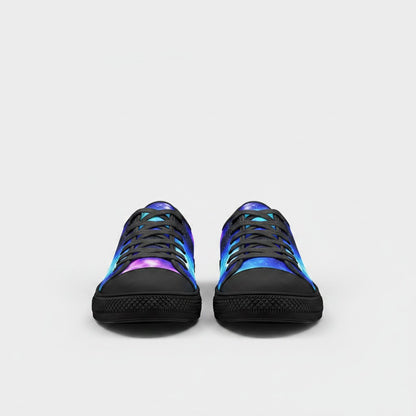 Freaky Shoes® low-top canvas sneakers featuring a vibrant purple and blue galaxy print with black laces and soles.