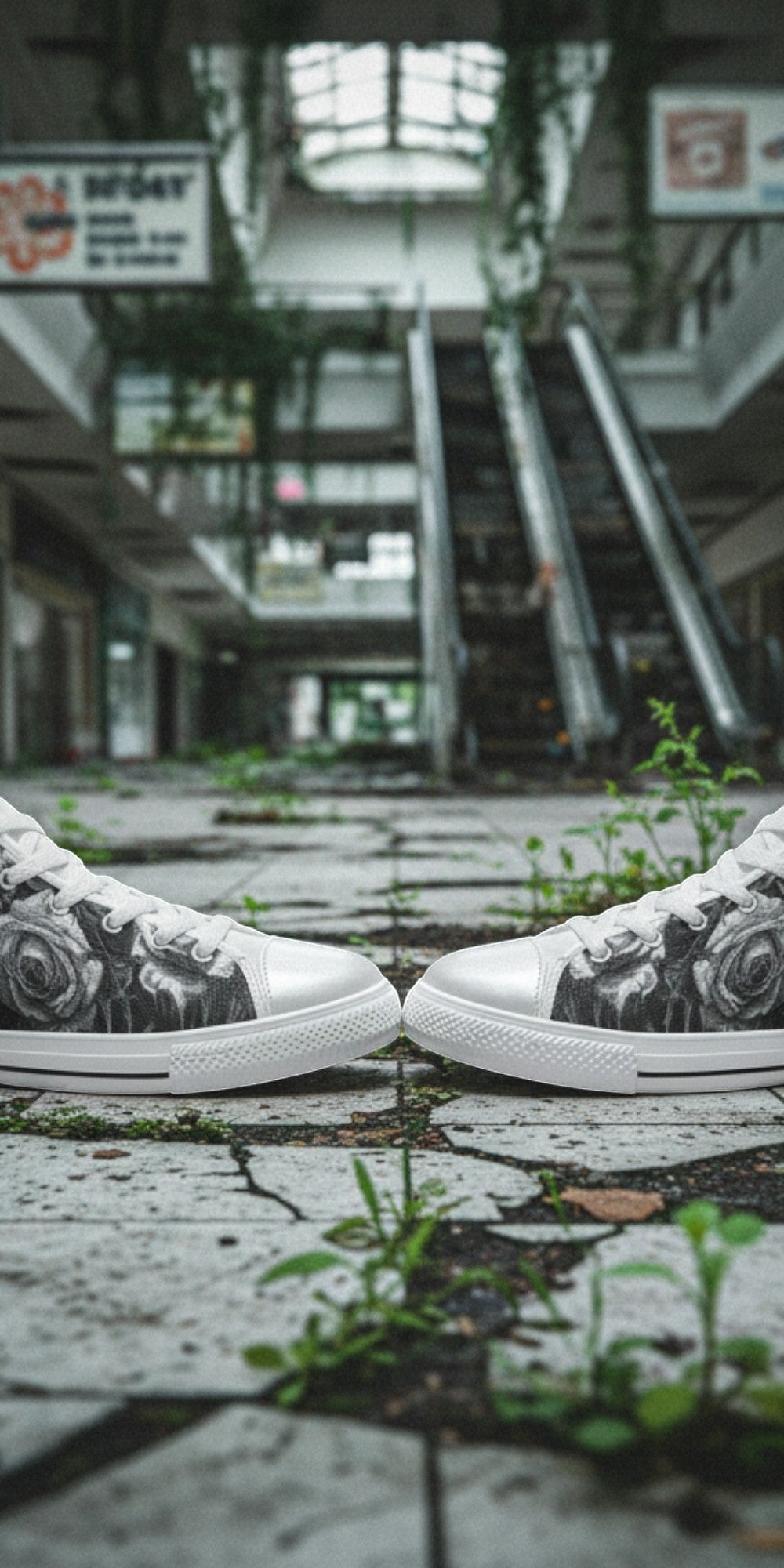 Freaky Shoes® men's gothic high top canvas sneakers with black and white skull and rose print in an abandoned mall.