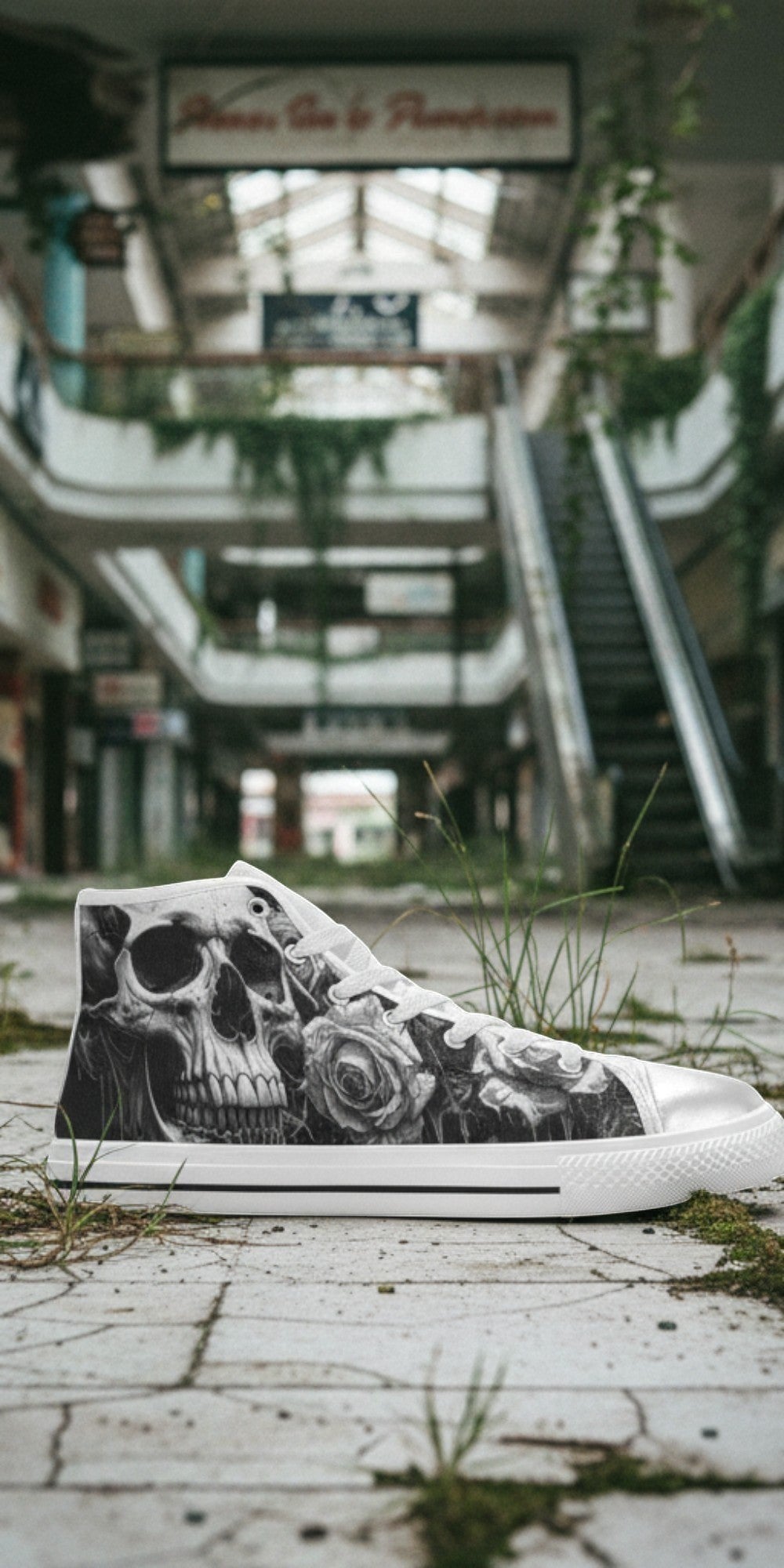 Freaky Shoes® high top canvas sneakers featuring a gothic skull and rose print in an abandoned mall setting.