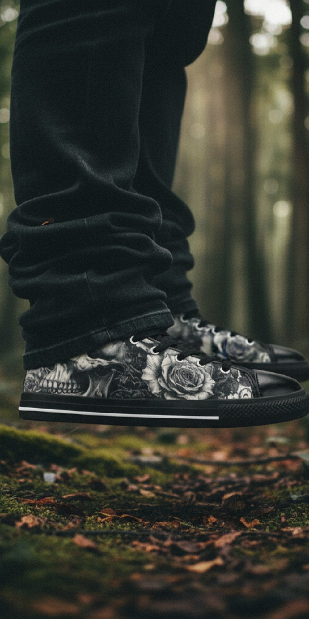 Freaky Shoes® gothic skull and rose print canvas high top sneakers worn in a misty forest setting.