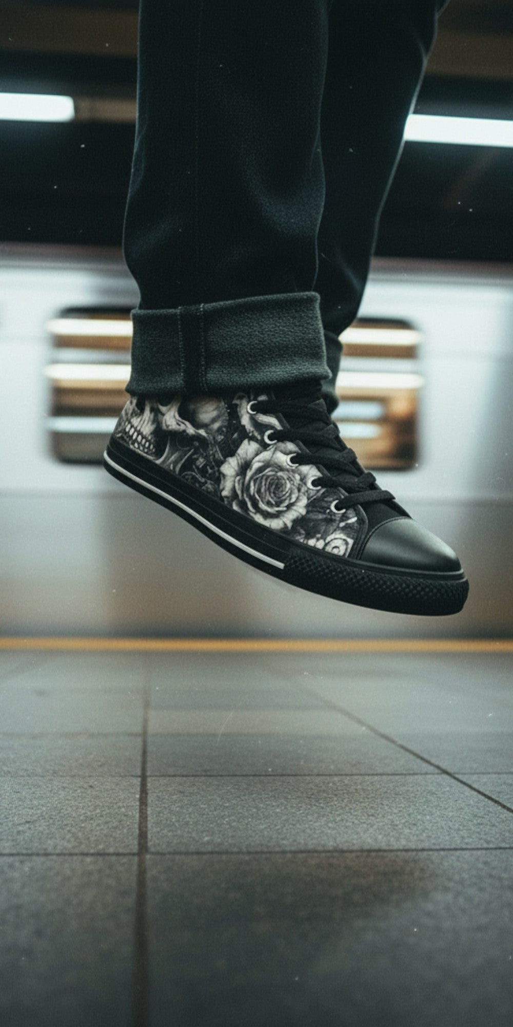 Freaky Shoes® gothic skull and rose print high top canvas sneakers with black laces in a subway station.