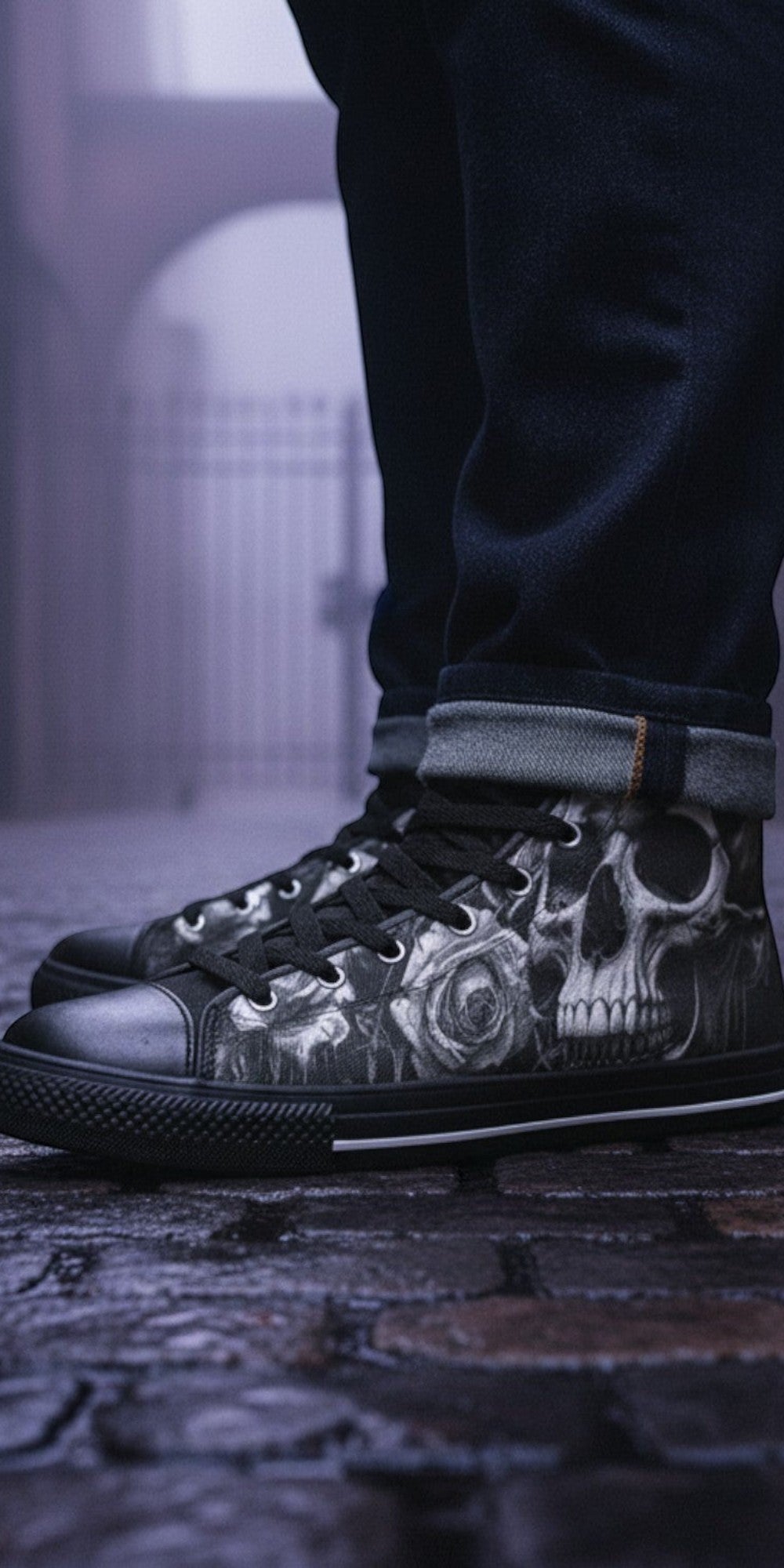 Freaky Shoes® Gothic high top canvas sneakers featuring a black and white skull and rose print on a cobblestone street
