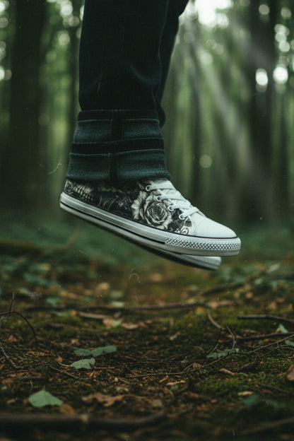 Freaky Shoes® grey rose and skull print canvas high top sneakers worn in a moody forest setting.