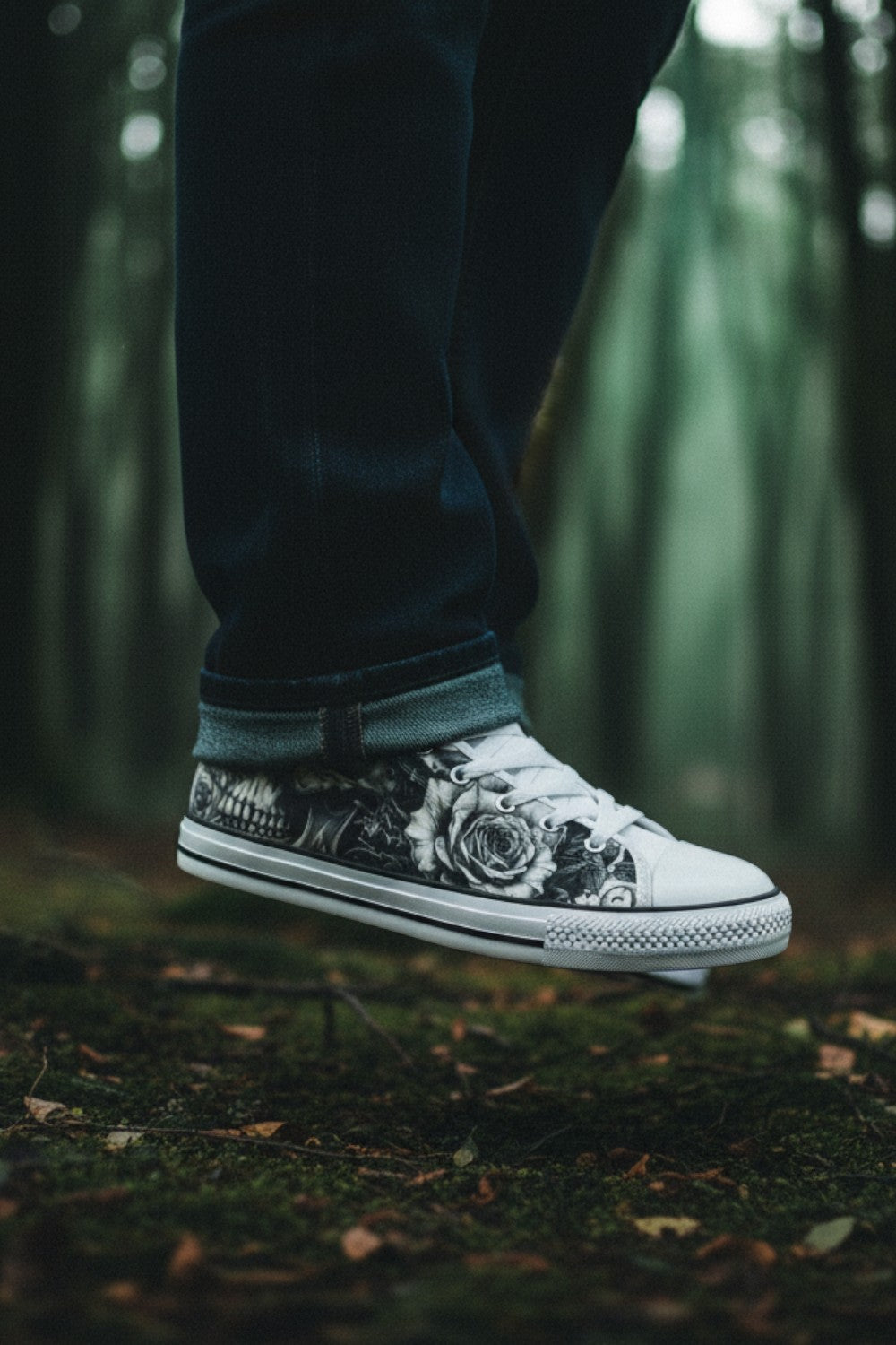Freaky Shoes® grey canvas sneakers featuring a gothic skull and rose print, worn in a moody forest setting.
