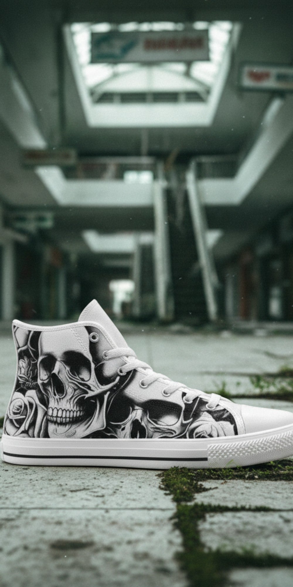 Freaky Shoes® high-top canvas sneakers featuring a grey and black skull and rose print in an abandoned mall setting.