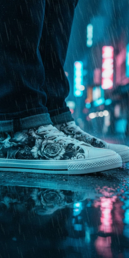 Freaky Shoes® monochrome skull and rose print high top canvas sneakers worn in a rainy city street at night.