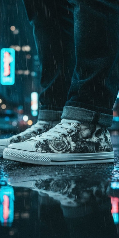 Freaky Shoes® monochrome skull and rose canvas high top sneakers worn in a rainy city street at night.