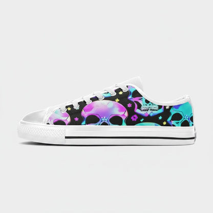 Freaky Shoes® women's canvas low-top sneakers featuring a vibrant neon skull pattern on a black background.