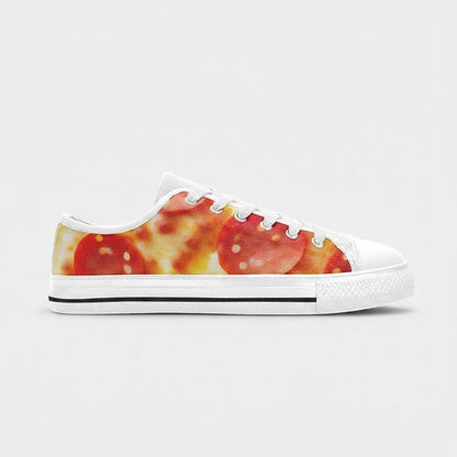 Freaky Shoes® women's low-top canvas sneakers featuring a vibrant pepperoni pizza cheese print and white rubber soles.
