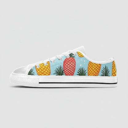 Freaky Shoes® women's low-top canvas sneakers featuring a light blue background with a vibrant pineapple print.