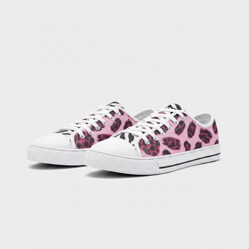 Freaky Shoes® low-top canvas sneakers featuring a vibrant pink and black animal print pattern with white laces.