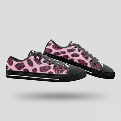 Freaky Shoes® low-top canvas sneakers featuring a vibrant pink and black animal print pattern with black laces.