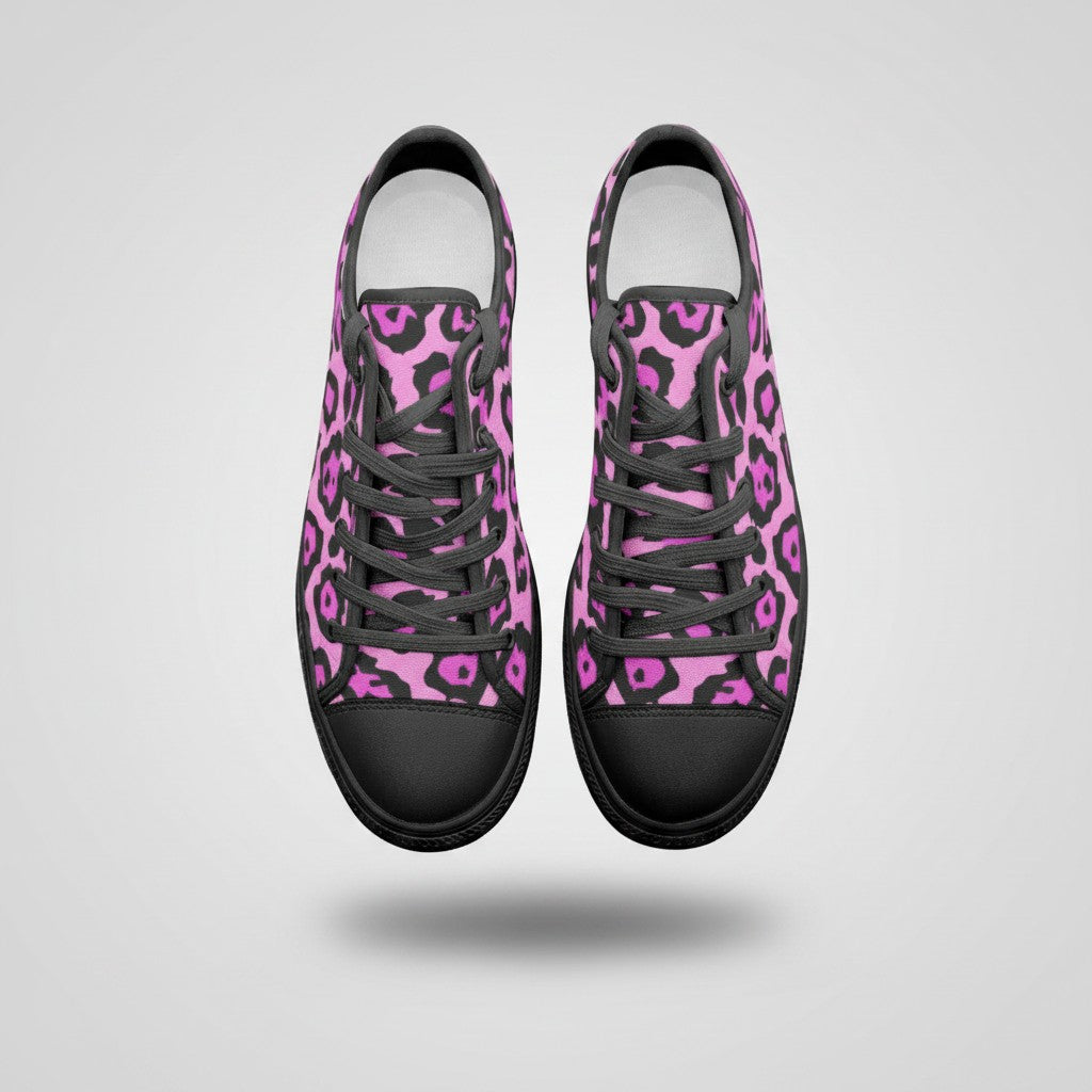 Freaky Shoes® low-top canvas sneakers featuring a vibrant pink and black animal print pattern with black laces.