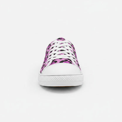 Freaky Shoes® low-top canvas sneakers featuring a vibrant pink and black animal print pattern with white laces