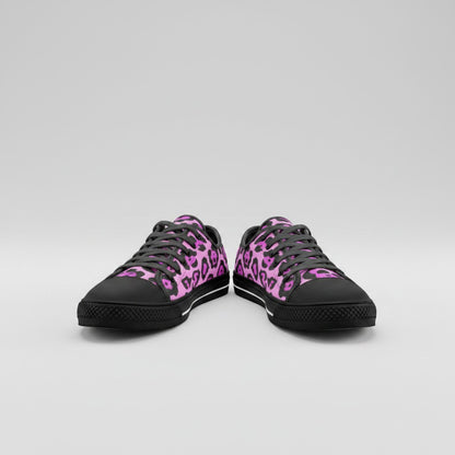 Freaky Shoes® low-top canvas sneakers featuring a vibrant pink and black animal print pattern with black laces.