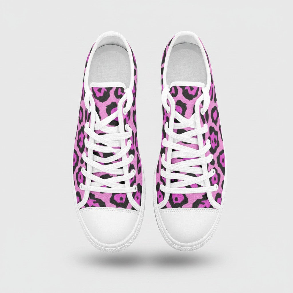 Freaky Shoes® low-top canvas sneakers featuring a vibrant pink and black animal print pattern with white laces.