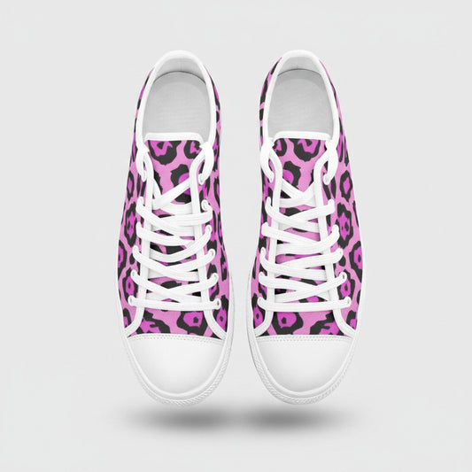 Freaky Shoes® low-top canvas sneakers featuring a vibrant pink and black animal print pattern with white laces.