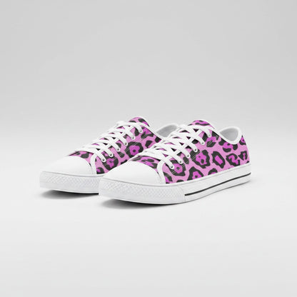Freaky Shoes® low-top canvas sneakers featuring a vibrant pink and black animal print pattern with white laces.
