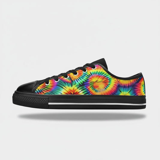 Freaky Shoes® women's low-top canvas sneakers featuring a vibrant rainbow tie-dye pattern and black rubber soles.