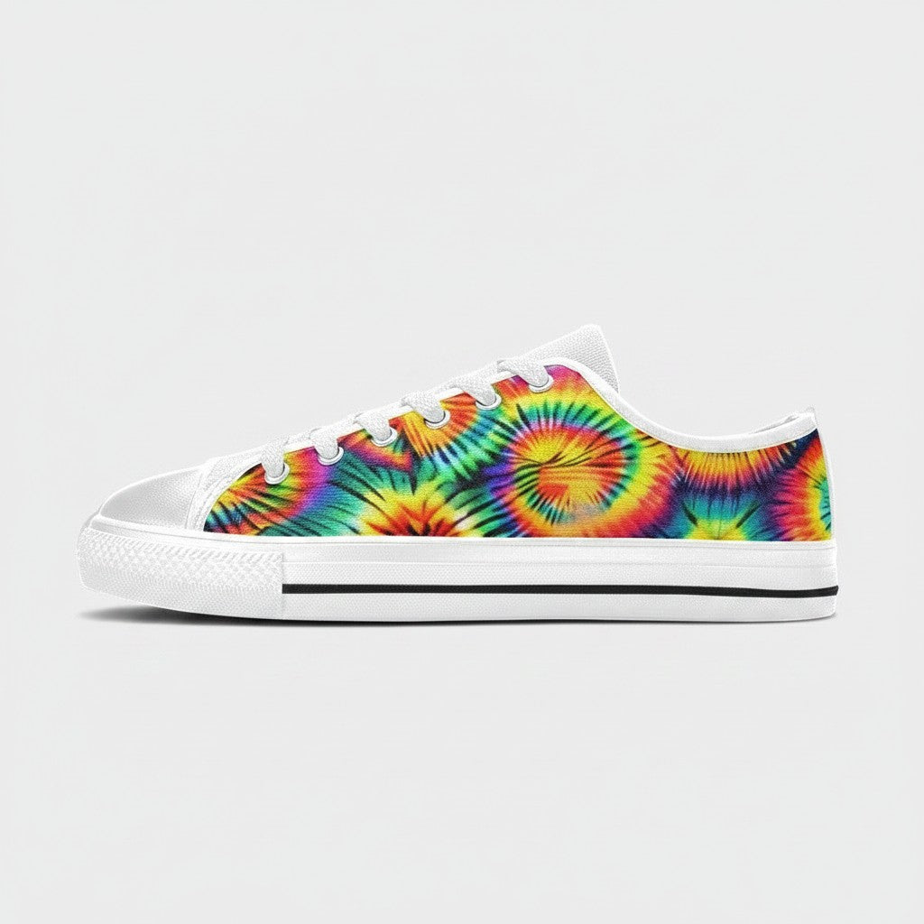 Freaky Shoes® women's low-top canvas sneakers featuring a vibrant rainbow tie-dye spiral pattern and white laces.