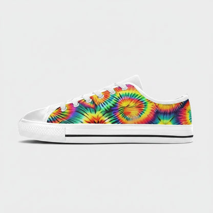 Freaky Shoes® women's low-top canvas sneakers featuring a vibrant rainbow tie-dye spiral pattern and white laces.