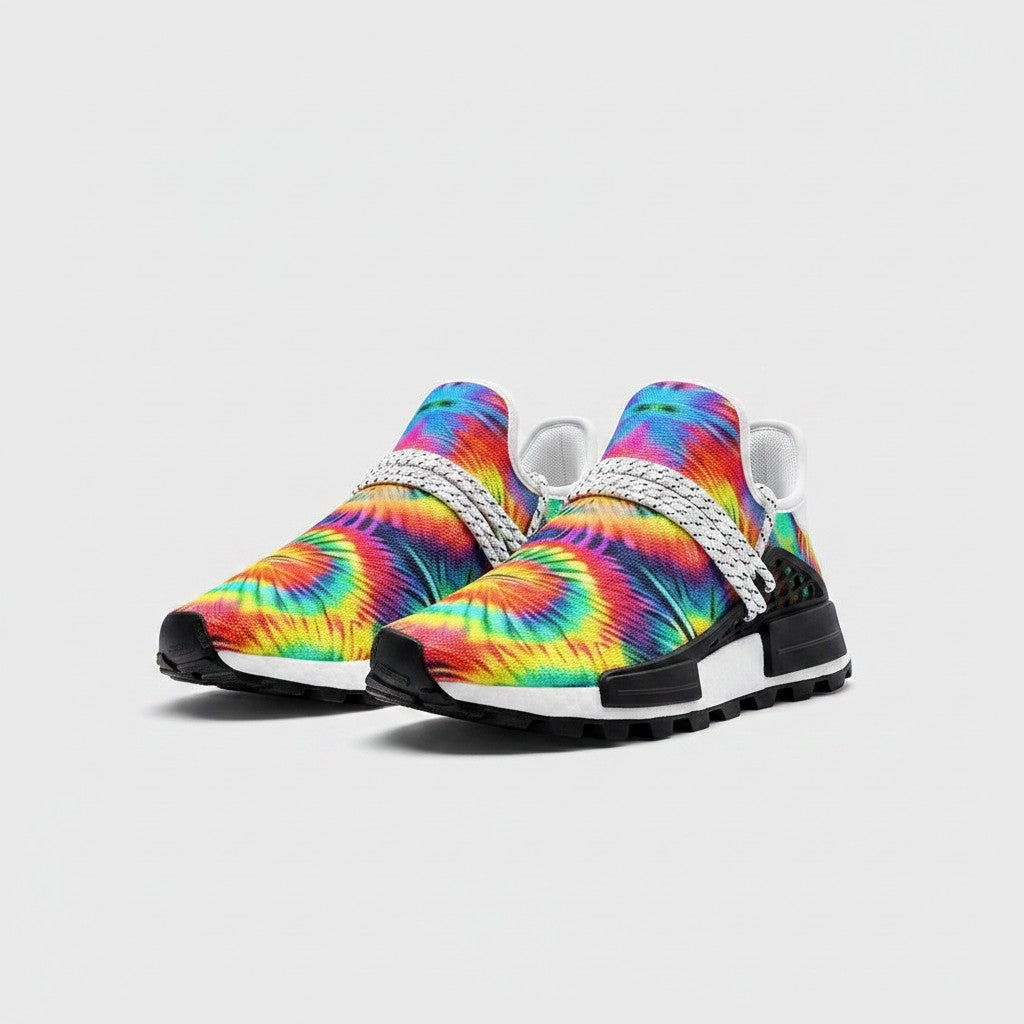 Freaky Shoes® rainbow tie dye high-top canvas sneakers with white laces and black EVA soles on a light background.