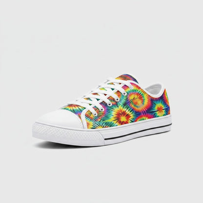 Freaky Shoes® rainbow tie dye canvas sneakers with white laces and rubber toe cap, side view.