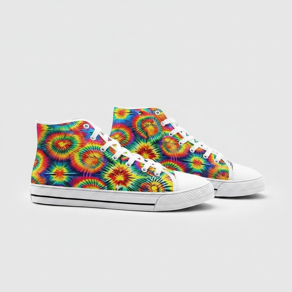 Freaky Shoes® rainbow tie dye high-top canvas sneakers with white laces and rubber soles on a light grey background.