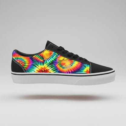 Freaky Shoes® men's low-top canvas skateboarding shoes featuring a vibrant rainbow tie-dye print and black accents.
