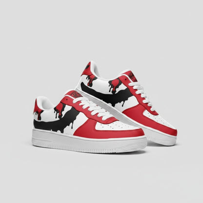 Freaky Shoes® custom low-top leather sneakers in red and white with a black paint drip design and white laces.