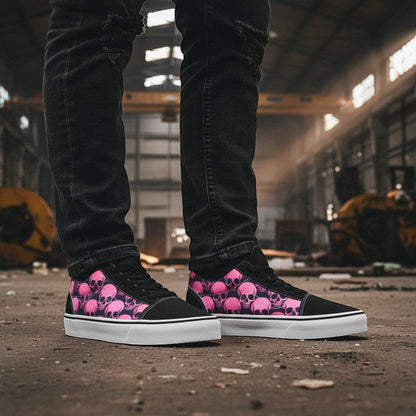 Freaky Shoes® women's low-top canvas skate shoes featuring a pink and black skull comix print in an industrial setting.