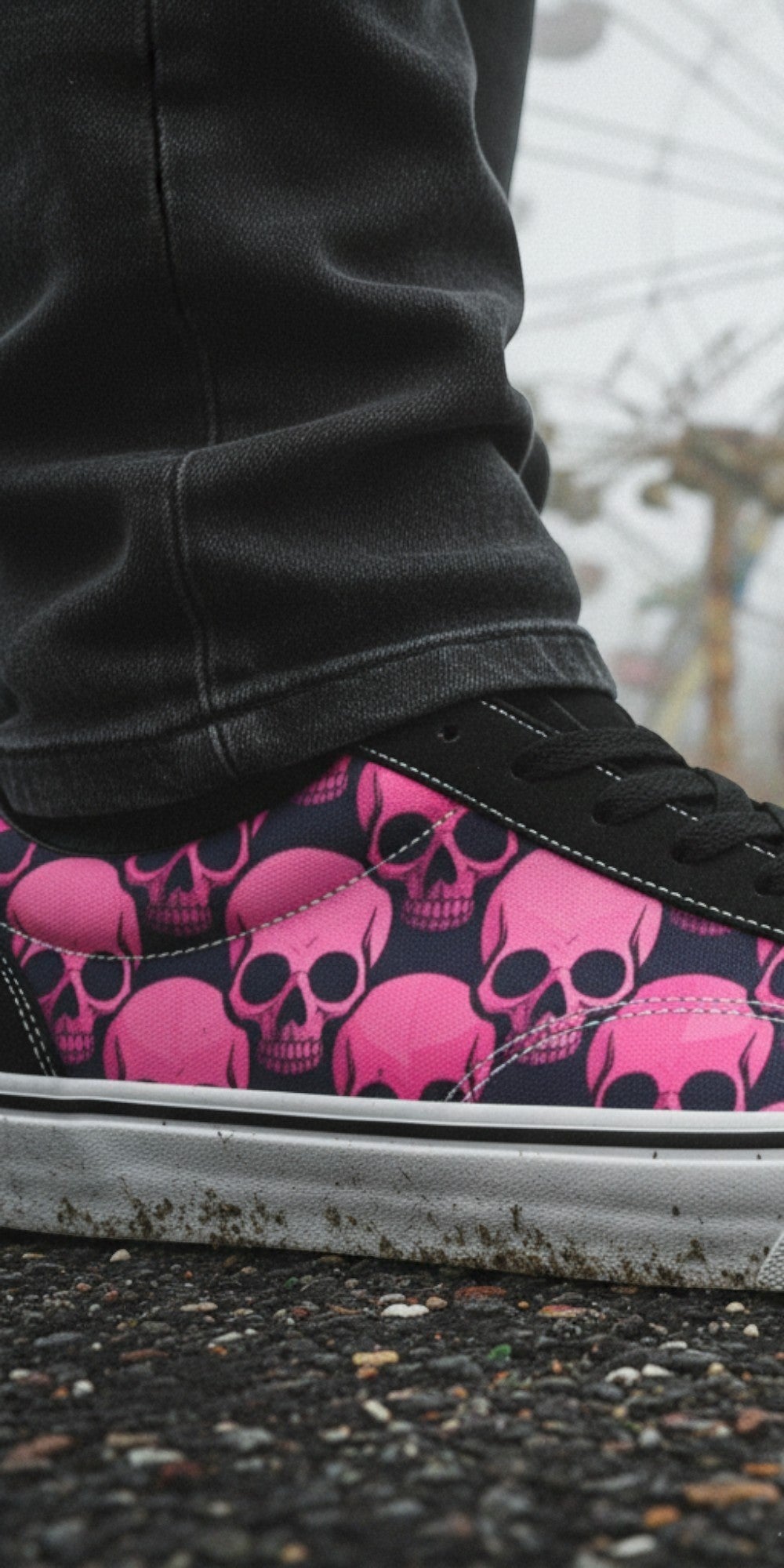 Freaky Shoes® women's low top skate sneakers featuring a pink and black skull comic print on a foggy carnival backdrop.