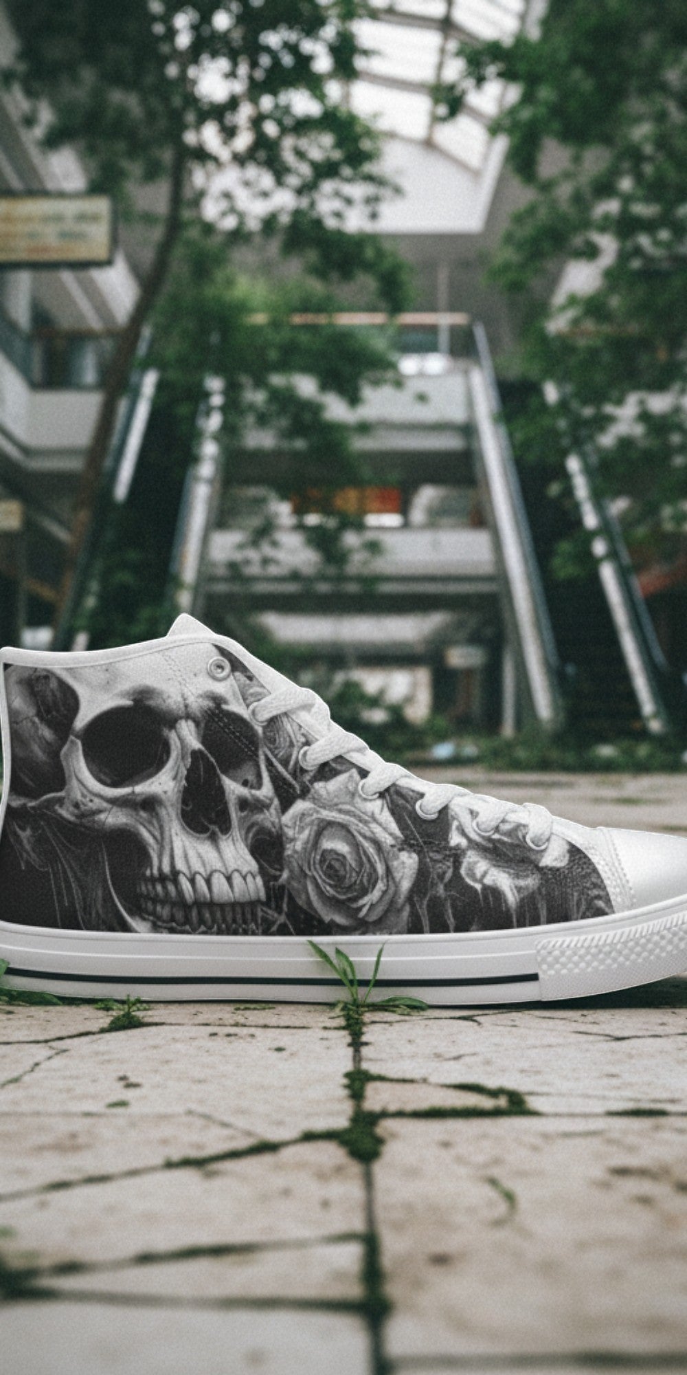 Freaky Shoes® men's gothic high top canvas sneakers with grey and black skull and rose print on a cracked floor.
