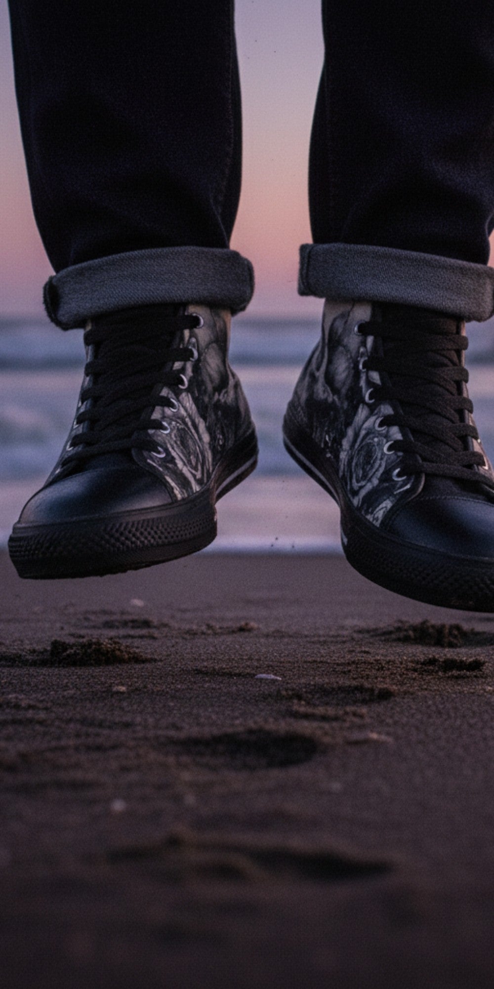 Freaky Shoes® men's high top canvas sneakers with skull and rose dark art print, worn on a beach at sunset.