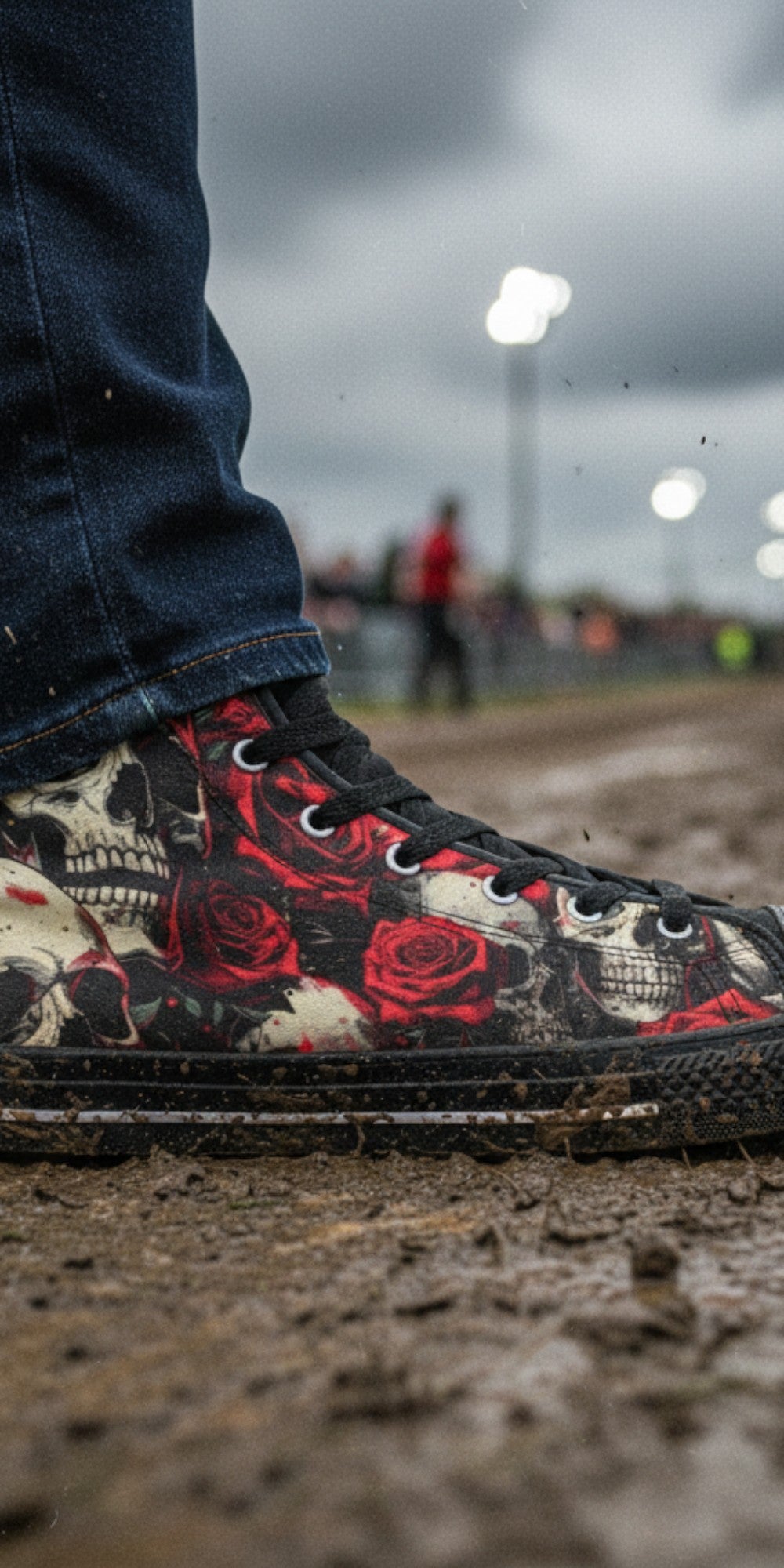 Freaky Shoes® men's high top canvas sneakers featuring a bold comic skull and red rose graphic print in muddy field.